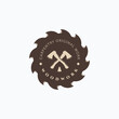 Lumberjack vintage axe and saw blade vector illustration badge. Simple carpentry logo design