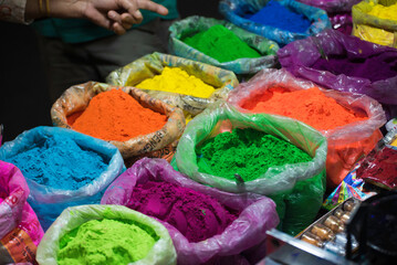 Poster - Exhibit colorful powder in a bag for sell for sell during Indian traditional festival holi