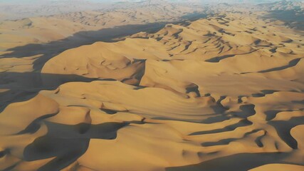 Wall Mural - aerial video of the golden desert in sunset