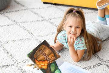 Poster - Cute little girl reading book at home