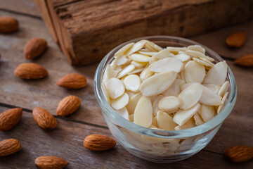 Wall Mural - Almond slices in glass bowl.