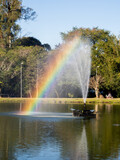 Fototapeta Tęcza - Rainbow over a fountain