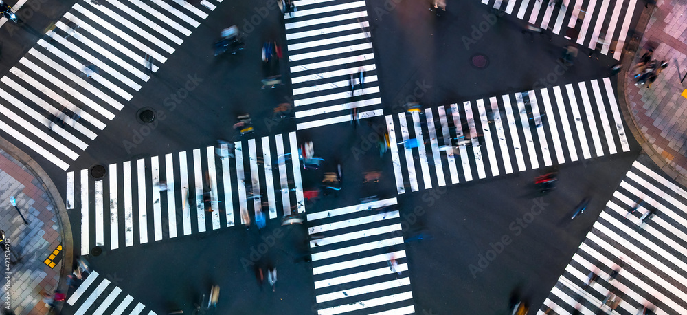 Traffic and people cross a busy intersection in Ginza - obrazy, fototapety, plakaty 