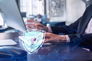 Poster - A programmer is typing a code on computer to protect a cyber security from hacker attacks and save clients confidential data. Padlock Hologram icons over the typing hands. Formal wear.