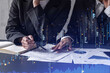 © VideoFlow - Two traders researching historic data to predict stock market behavior. Women in trading business concept. Forex and financial hologram chart over the table with the document.