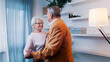 © CameraCraft - Happy elderly couple dancing at home in formal wear. Love and dating at old age. High quality photo
