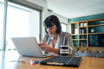 Wall Mural - Young woman working at home. Home office.