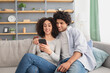 © Prostock-studio - Shopping together at home during covid-19, funny video, online meeting and surfing in internet