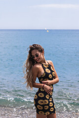 Wall Mural - Blonde woman enjoying holidays in the beach