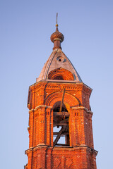 the dome of the village church is made of red brick