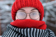 © Вячеслав Думчев - Portrait of a young woman in misted glasses outdoors on a frosty snowy day