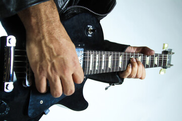 Man playing Gibson Les Paul Studio T ebony guitar close up fingers