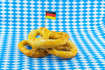 German pretzel with the flag of Germany, symbol of the Oktoberfest beer festival