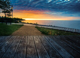Fototapeta Pomosty - Wooden pier at sunset