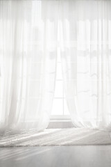 Backlit window with white curtains in empty room