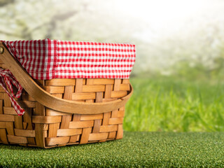 Wall Mural - picnic basket on the background of the garden.Concept of rest and summer mood.