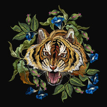 Embroidery Tiger Head And Beautiful Blue Flowers. Wild Animals Art. Fashionable Template For Design Of Clothes, T-shirt Design