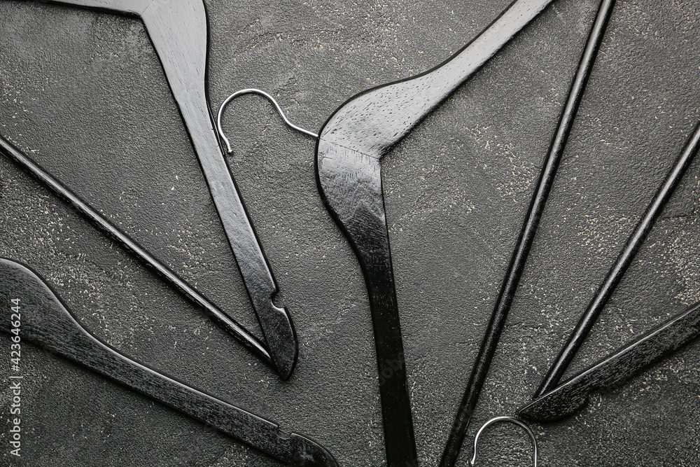 Clothes hangers on dark background
