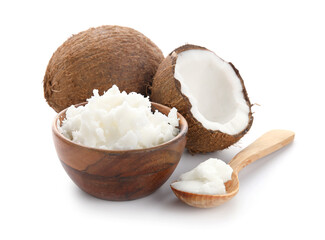 Spoon and bowl with coconut oil on white background