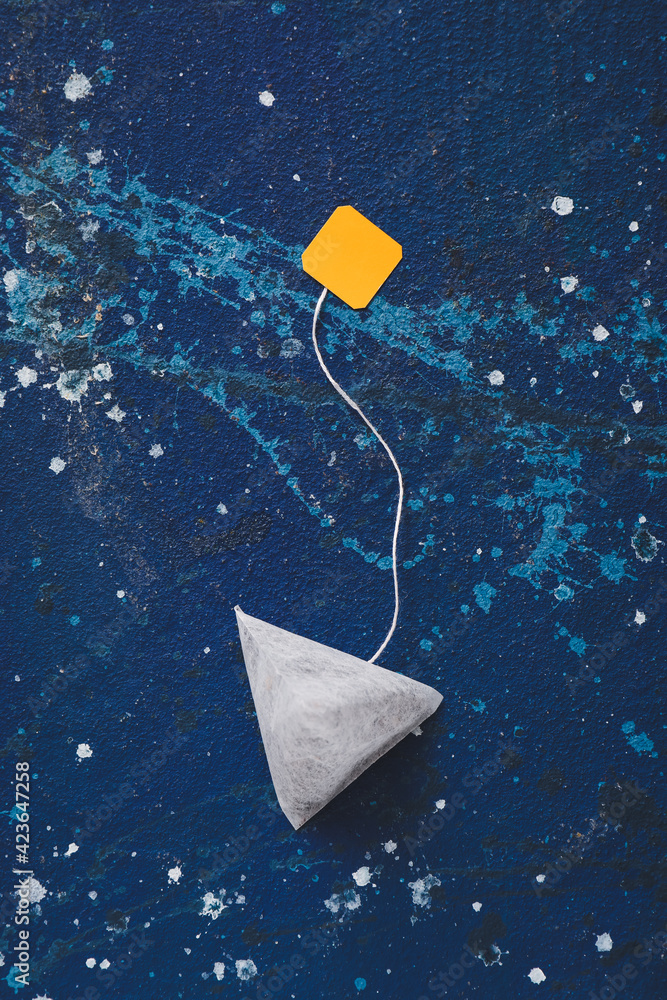Tea bag on color background