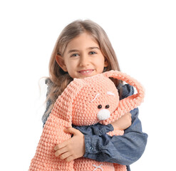 Poster - Happy little girl hugging toy on white background