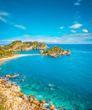 Fototapeta  -  Vertical panorama of Isola Bella beach in Taormina, Sicily. Sunny bright day at lovely tropical beach in Sicily 