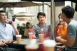 © imtmphoto - group of young asian adults relaxing at outdoor coffee shop