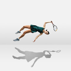 Wall Mural - Young caucasian professional sportswoman levitating, flying while playing tennis isolated on white background