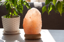Himalayan Pink Salt Crystals Lamp At Home. Health And Calm Concept.