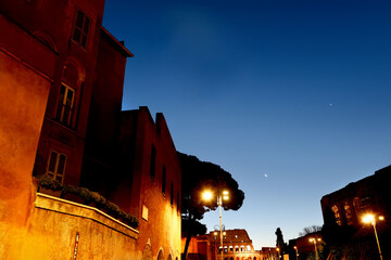 Streets of Rome and the building of the Colosseum at night. 