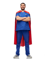 Wall Mural - healthcare, profession and medicine concept - happy smiling doctor or male nurse in blue uniform and red superhero cape over white background