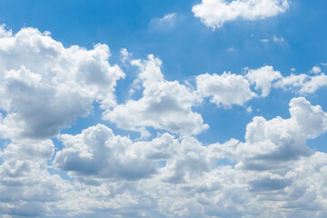 Wall Mural - beautiful blue sky with whipped white clouds that are illuminated by the sun