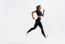 Athletic Fitness Runner Girl, Silhouette Of Woman Jogging On White Background In Black Sportswear, Wearing Sport Active Clothing On Workout, Running