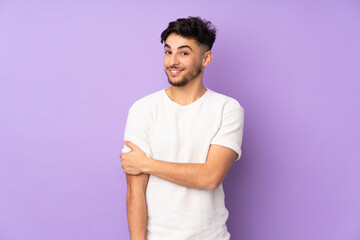 Arabian handsome man over isolated background laughing