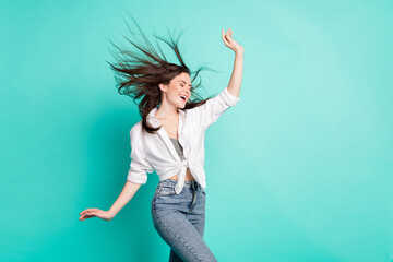 Sticker - Photo of happy positive cheerful young woman fly hair wind dance enjoy spring isolated on teal color background