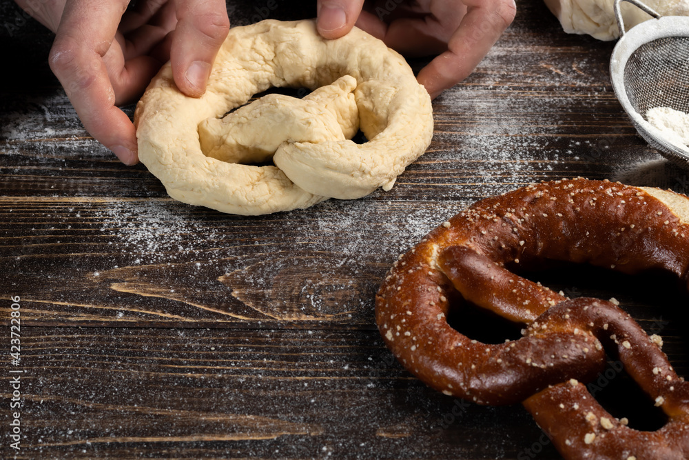 Step-by-step instructions for making pretzels. The cook rolls out the
