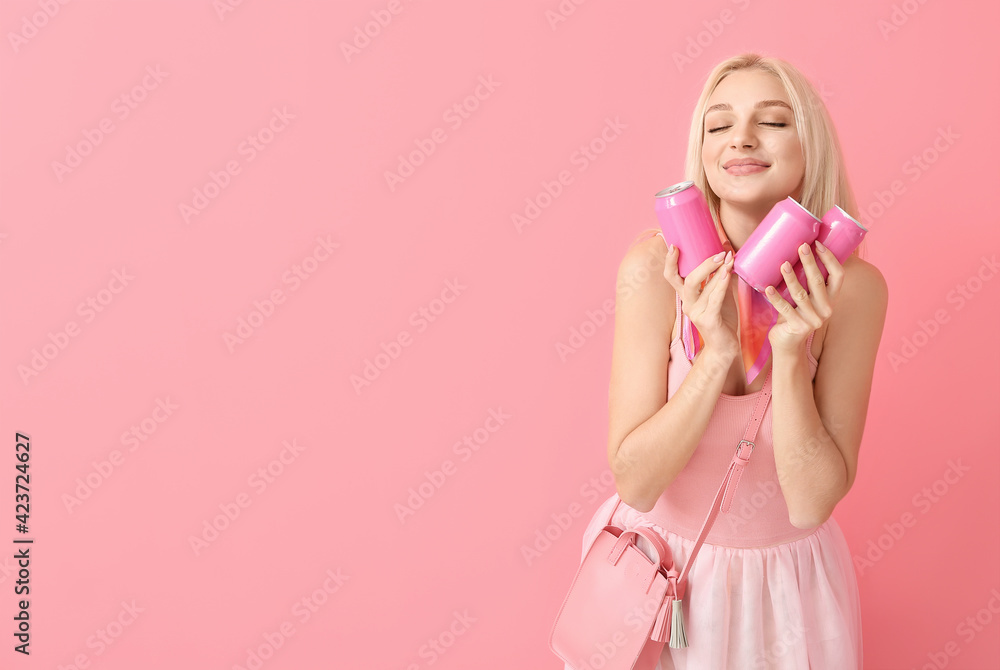 Beautiful young woman with soda on color background