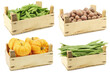 Assorted cooking vegetables in a wooden crate on a white background
