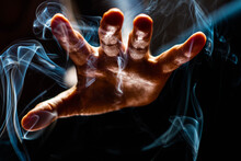 Magic Hand In  Smoke And In A Worm Striking Light 
