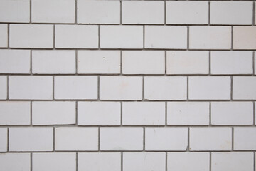 Wall Mural - White stone background consisting of white bricks