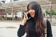 © eakgrungenerd - asian woman talking with mobile phone. communication wireless personal.