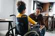 © NDABCREATIVITY - Single parent with handicapped child with disability in wheelchair