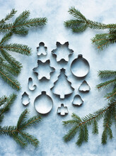 Still Life Of Metal Cookie Cutters With Christmas Tree Twigs
