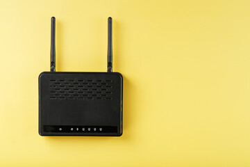 Router wireless LAN technology with devices based on IEEE 802.11 standards on a yellow background free space top view.