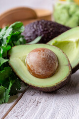 Wall Mural - Guacamole sauce ingredients close up, avocado, red onion, cilantro, lime