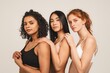 © Ivan - Photo of optimistic young women, multiracial friends wear underwear, hug each other and show their love. Concept natural beauty and girl power