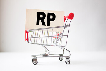 a business card with text RP in a shopping cart. business and finance