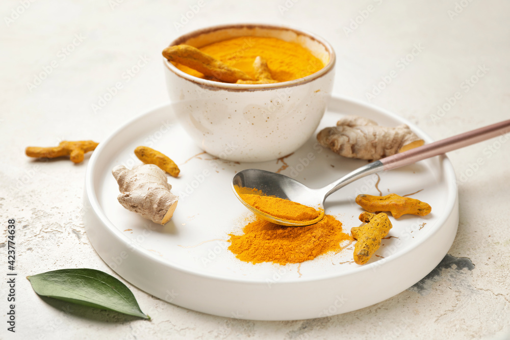 Composition with turmeric powder on grunge background
