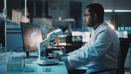 Wall Mural - medical research scientist is using desktop computer writes results, conducts dna experiments under 