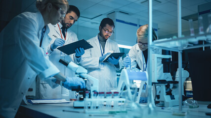 Wall Mural - team of medical research scientists have meeting and conduct experiments with help of dna samples in